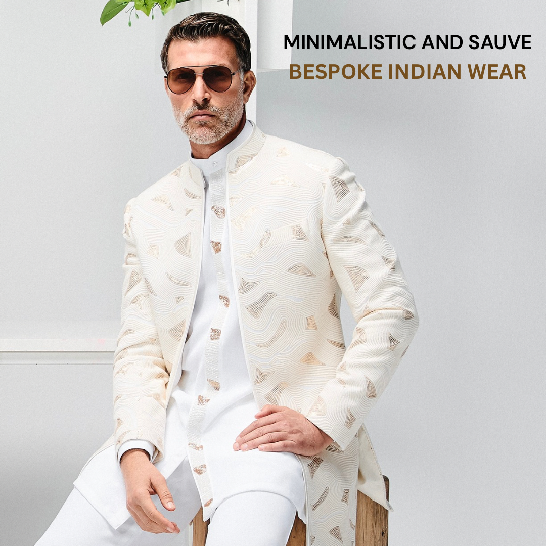 Man wearing cream bespoke Indian jacket with subtle pattern over white kurta and trousers, minimalist style